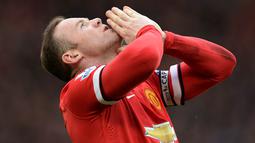 Manchester United akhirnya berhasil kembali ke Liga Champions. Setan Merah berada pada posisi empat klasemen akhir Premier League musim 2014/2015. (AFP/Oli Scarff)