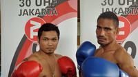 Roy Mukhlis (kanan) akan bertarung melawan Allan Tanada dalam perebutan sabuk juara kelas ringan WPBF Asia Pasifik. (Dokumen pribadi)