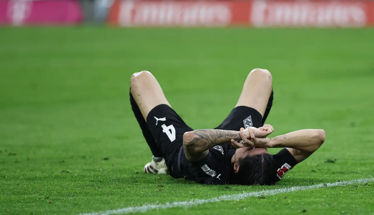Hasil itu membuat Kevin Diks Cs menempati posisi ke-15 dengan raihan 25 poin di klasemen sementara Bundesliga 2025/2026. (AFP/Alexandra Beier)