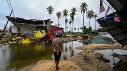 Banjir besar disebabkan oleh hujan tanpa henti yang melanda negara-negara bagian wilayah utara Malaysia. (MOHD RASFAN/AFP)