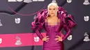 <p>Christina Aguilera menghadiri Latin Grammy Awards 2022 di Michelob Ultra Arena, Las Vegas, Nevada, Amerika Serikat, 17 November 2022. Gaun panjang berwarna ungu yang ketat membuat Christina memancarkan aura seksinya. (Frazer Harrison/Getty Images/AFP)</p>