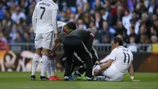 Winger Madrid Gareth Bale sedang dipantau kondisinya oleh tim dokter karena mengalami cedera. (AP Photo/Andres Kudacki)