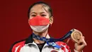 Bukan hanya medali perdana Indonesia, ini juga medali pertama untuk Windy Cantika pada ajang Olimpiade. (Foto: AFP/Vicenzo Pinto)