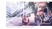 Penyandang disabilitas ini tak patah semangat hingga mampu membeli motor Harley Davidson untuk berjualan. (Merdeka.com)