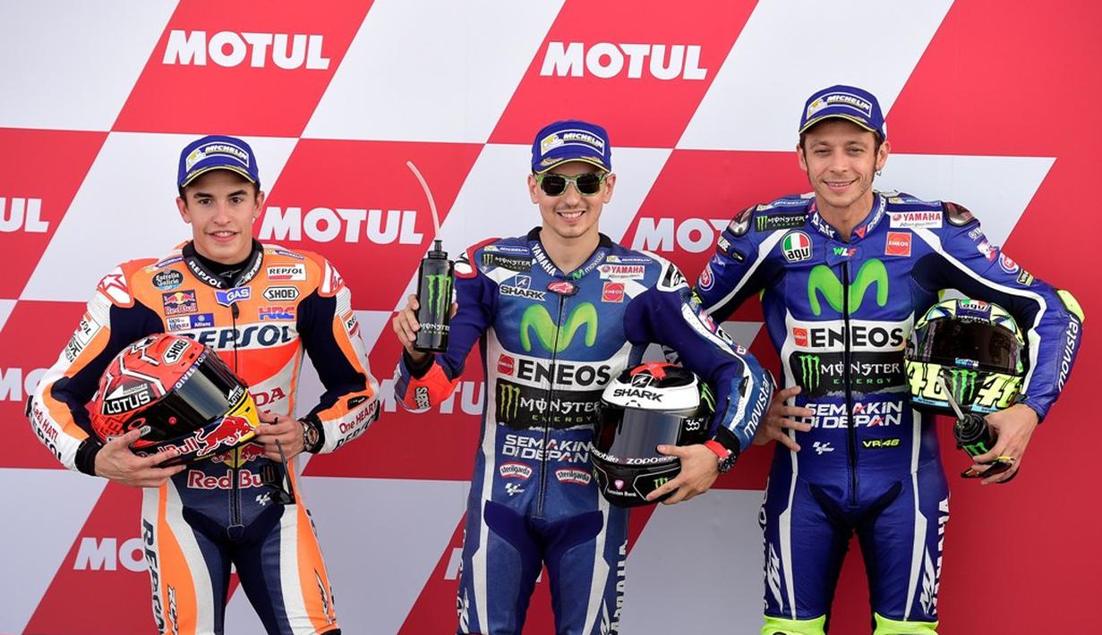 Marc Marquez, Jorge Lorenzo, dan Valentino Rossi akan start di barisan depan saat balapan MotoGP Valencia di Sirkuit Ricardo Tormo, Minggu (13/11/2016). (AFP/Jose Jordan)