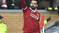 Bintang Liverpool, Mohamed Salah menjadikan persaingan top scorer Liga Champions semakin berwarna. Hinggal babak 16 besar Salah sudah mengoleksi enam gol. (Anthony Devlin/PA via AP)