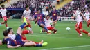 Kemenangan ini membawa Barcelona ke puncak klasemen dengan 22 poin dari sembilan laga. Mereka masih bisa digeser Real Madrid yang memiliki 21 poin dan baru bermain melawan Getafe pada Senin dini hari. (AFP/Josep Lago)