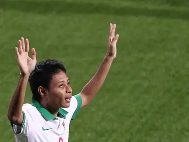 Ekspresi Evan Dimas Darmono setelah mencetak gol ke gawang Singapura U-23 dalam penyisihan Grup A Sepakbola SEA Games 2015 di Stadion Jalan Besar, Singapura. Kamis (11/6). (Bola.com/Arief Bagus)