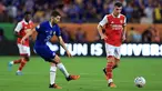 Gelandang Chelsea, Jorginho mengoper bola dari kawalan gelandang Arsenal, Granit Xhaka selama pertandingan Piala Florida di Camping World Stadium di Orlando, Florida pada 23 Juli 2022. Jorginho bergabung dengan pemimpin Liga Premier Arsenal dari Chelsea pada hari batas waktu transfer pada 31 Januari 2023 dengan biaya yang dilaporkan sebesar &pound;12 juta ($15 juta). (Sam Greenwood/Getty Images/AFP)
