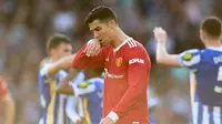 Cristiano Ronaldo diyakini sudah memberi tahu Manchester United bahwa dia ingin pergi pada bursa transfer musim panas 2022. Bintang asal Portugal itu rela gajinya dipotong demi bisa meninggalkan MU. (foto: Glyn KIRK / AFP)