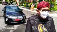 Bupati Sumenep Ahmad Fauzi dengan mobil listrik yang menjadi kendaraan dinas. (Dian Kurniawan/Liputan6.com).