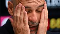 Kekecewaan tak mampu ditutupi pelatih Pep Guardiola setelah gagal membawa Manchester City menjadi juara Liga Inggris 2025/2026. (AFP/Glyn Kirk)