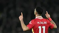 Mohamed Salah kembali bersinar saat Liverpool bertemu Everton di Goodison Park pada lanjutan Liga Inggris 2024/2025, Kamis (13/2/2025) dini hari WIB. (Paul ELLIS / AFP)