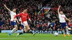 Striker Manchester United (MU) Cristiano Ronaldo (kedua kiri) menembak untuk mencetak gol kedua timnya ke gawang Tottenham Hotspur pada pekan ke-29 Liga Inggris di Old Trafford, Minggu (13/3/2022) dini hari WIB. Ronaldo mencetak hattrick untuk membawa MU menang 3-2. (Lindsey Parnaby/AFP)