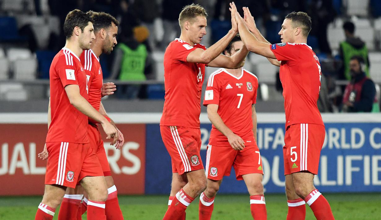 Para pemain Wales merayakan kemenangan saat melawan Georgia pada kualifikasi Piala Dunia 2018 grup D di Boris Paichadze Dinamo Arena, Tbilisi (06/10/2017). Wales menang 1-0. (AFP/Vano Shlamov)