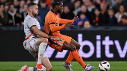 Timnas Belanda menggulung Timnas Islandia dengan skor telak 4-0. (JOHN THYS / AFP)