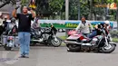 Peserta dengan motor gedenya berwarna merah terlihat kehilangan keseimbangan. (Liputan6.com/Johan Tallo)