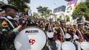 Siswa Akademi Kepolisian melakukan atraksi saat Parade Asian Games 2018 di Jakarta, Minggu (13/5/2018). Parade ini diadakan untuk mempopulerkan multievent empat tahunan tersebut. (Bola.com/Vitalis Yogi Trisna)
