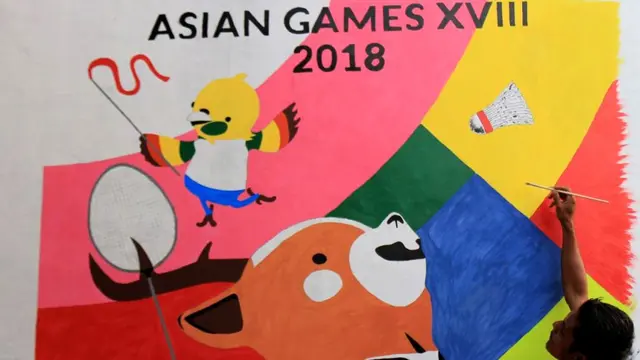 Nyaris tiap hari pemuda RW 12 Kecamatan Cilacap Selatan, Cilacap, menghias tembok, papan dan memasang beragam atribut Asian Games 2018. (Foto: Liputan6.com/Muhamad Ridlo)