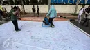 Kampanye aksi sekaligus penandatanganan spanduk “Deklarasi Hidup Tanpa Hoax dan Fitnah di kawasan Car Free Day Bundaran HI, Jakarta, Minggu (29/1). Aksi itu untuk meningkatkan kewaspadaan terhadap berita hoax dan fitnah. (Liputan6.com/Faizal Fanani)