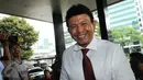 Kabareskrim Polri,  Irjen Ari Dono Sukmanto tersenyum saat tiba di gedung Komisi Pemberantasan Korupsi (KPK), Jakarta, Senin (18/7).Keperluannya datang ke KPK juga untuk membahas beberapa kasus korupsi. (Liputan6.com/Helmi Afandi)