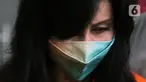 Wakil Direktur PT Adonara Propertindo, Anja Runtuwene usai menjalani rilis penahanan di Gedung KPK, Jakarta, Rabu (2/6/2021). Anja Runtuwene merupakan tersangka dugaan korupsi pengadaan tanah terkait program pembangunan rumah DP Rp 0,- di Munjul Pondok Ranggon. (Liputan6.com/Helmi Fithriansyah)