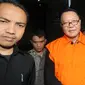 Anggota DPR F-PDIP, I Nyoman Dhamantra memakai rompi tahanan usai menjalani pemeriksaan di Gedung KPK, Jakarta, Jumat (9/8/2019). I Nyoman Dhamantra resmi ditahan terkait suap izin impor bawang putih dari Kementerian Pertanian dan SPI dari Kemendag. (merdeka.com/Dwi Narwoko)