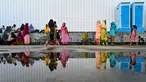 Pengungsi Rohingya berkumpul di tempat penampungan sementara sebuah pelabuhan di Pulau Sabang, Provinsi Aceh, Indonesia, Senin (18/12/2023). Sebagian besar Muslim Rohingya menjadi sasaran tindakan keras militer Myanmar pada tahun 2017 dan menjadi sasaran penyelidikan genosida Perserikatan Bangsa-Bangsa (PBB). (CHAIDEER MAHYUDDIN/AFP)