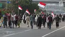 Sejumlah peserta massa aksi Gerakan Nasional Kedaulatan Rakyat saat melakukan unjuk rasa menuju depan Gedung Bawaslu, Jakarta, Selasa (21/5). Mereka menolak hasil Pemilu 2019 yang dinilai banyak terdapat kecurangan. (Liputan6.com/Helmi Fithriansyah)