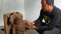 Arca Nandiswara ditemukan dengan kondisi patah di bagian kepala saat ekskavasi tahap kedua di Situs Srigading, Lawang, Malang. BPCB Jawa Timur merestorasi arca lebih dulu sebelum disimpan di Museum Singasari Malang (Liputan6.com/Zainul Arifin)