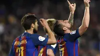 Selebrasi penyerang Barcelona Paco Alcacer usai mencetak gol ke gawang Real Sociedad. (LLUIS GENE / AFP)