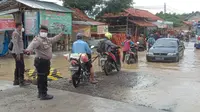 Banjir Ikut Rendam Jalan Sampang-Bangkalan hingga 70 Cm