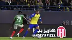 Cristiano Ronaldo dari Al Nassr (kanan) berusaha melewati pemain Al Ettifaq, Abdallah Khateeb selama pertandingan Liga Pro Saudi di Stadion Mrsool Park, di Riyadh, Arab Saudi, Minggu (22/1/2023). Al Nassr menang tipis atas Ettifaq dengan skor 1-0. (AP Photo)