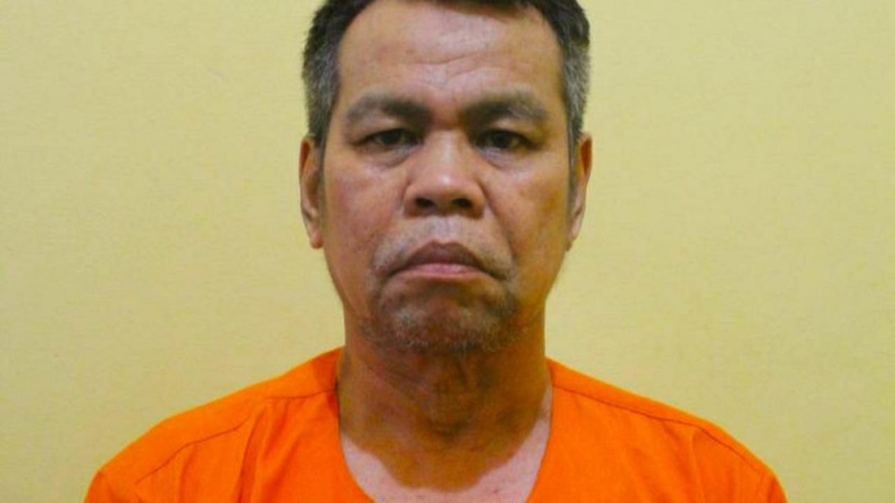 Wakil Bupati Bengkalis non aktif, Muhammad, memakai baju tahanan Polda Riau.