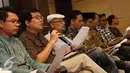 Aktivis koalisi masyarakat sipil membacakan komunike bersama revisi UU anti terorisme di Jakarta, Kamis (8/12). Mereka menilai revisi UU No 15 tahun 2003 tetap harus berpijak pada mekanisme criminal justice system model. (Liputan6.com/Helmi Fithriansyah)