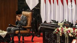 Presiden Joko Widodo menghadiri rapat Paripurna pembukaan masa persidangan I DPR tahun sidang 2022-2023 di Gedung Nusantara, Kompleks Parlemen, Senayan, Jakarta, Selasa (16/8/2022). Rapat kali ini berbeda dengan rapat sidang tahunan MPR RI pagi tadi, Presiden Jokowi hadir bersama Ma'ruf Amin dengan setelah jas yang rapi. (Liputan6.com/Johan Tallo)
