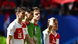 Volksparkstadion in Hamburg on June 19, 2024. (Photo by GABRIEL BOUYS / AFP)

Pemain Kroasia, Luka Modric,dan kawan-kawan tampak kecewa setelah ditahan imbang Albania pada laga Grup B di Volksparkstadion, Hamburg, Rabu (19/6/2024). (AFP/Gabriel Bouys)