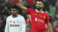 Enam menit menjelang akhir waktu pertandingan, Mohamed Salah berhasil mencetak gol kedua untuk kemenangan Liverpool sekaligus memastikan The Reds tetap berada di puncak klasemen Liga Premier Inggris 2024/2025 dengan 28 poin dari 11 pertandingan. (Paul ELLIS/AFP)