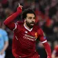 Selebrasi pemain Liverpool, Mohamed Salah setelah mencetak gol ke gawang Manchester City pada leg pertama perempat final Liga Champions di Anfield, Liverpool, Inggris, Rabu (4/4). Liverpool menang tiga gol tanpa balas. (Anthony Devlin/AFP)