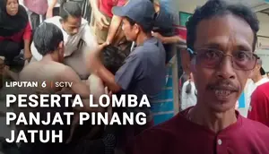 Peserta Lomba Panjat Pinang Jatuh