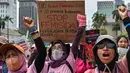 Pengujuk rasa dari Aliansi Perempuan Indonesia mengambil bagian dalam aksi protes di jalanan pada 16 Hari Internasional Penghapusan Kekerasan terhadap Perempuan, di Jakarta, 25 November 2024. (BAY ISMOYO/AFP)