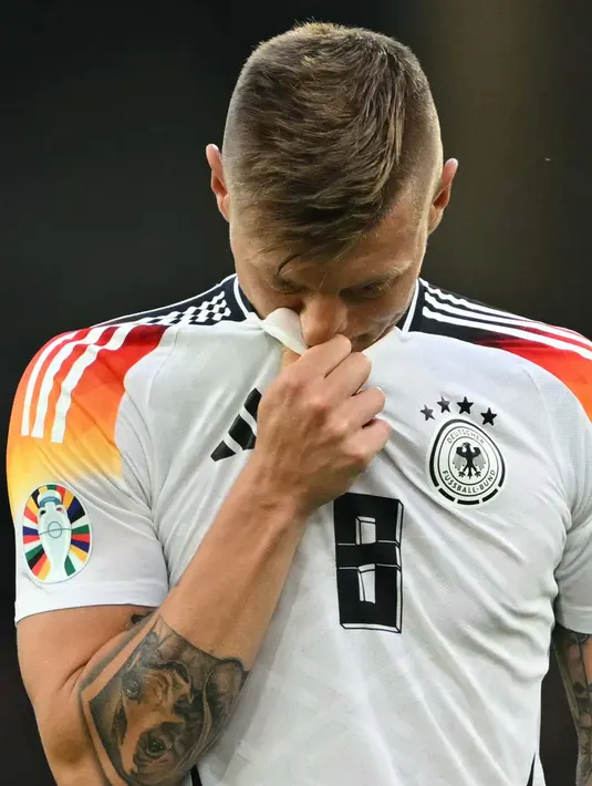 Saat ini, gelandang Die Mannschaft tersebut sudah berusia 34 tahun. (Fabrice COFFRINI/AFP)