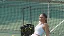 Sementara Wulan memilih dua potong outfit tenis yang ikonis dengan atasan cropped tank top dan mini skirt warna putih. [IG @wulanguritno]