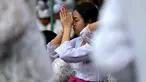 Umat Hindu berkumpul untuk berdoa di sebuah pura merayakan Galungan di Denpasar, Bali, Rabu (2/8/2023). (Photo by SONNY TUMBELAKA / AFP)