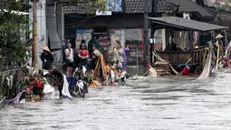 Beberapa wilayah yang terdampak banjir, di antaranya berada di Kabupaten Jembrana, Gianyar, Tabanan, Klungkung dan Kota Denpasar. (SONNY TUMBELAKA/AFP)
