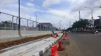 Pengerjaan tahap akhir underpass Dewi Sartika yang menghubungkan Jalan Raya Margonda, Kota Depok. (Liputan6.com/Dicky Agung Prihanto)
