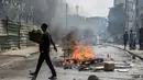 Pengunjuk rasa dan polisi bentrok di ibu kota Senegal, Dakar. (Seyllou/AFP)