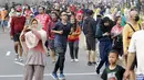 Suasana warga Jakarta berolahraga di Car Free Day (CFD), Kawasan Bundaran HI, Jakarta, Minggu (18/9/2022). (Bola.com/M Iqbal Ichsan)