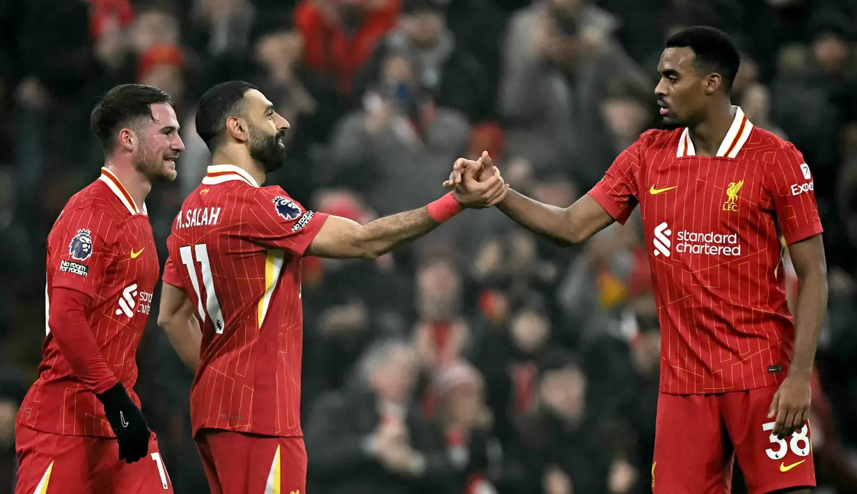 Mohamed Salah pada menit ke-82 berhasil mencetak gol kemenangan untuk Liverpool. (Paul ELLIS/AFP)