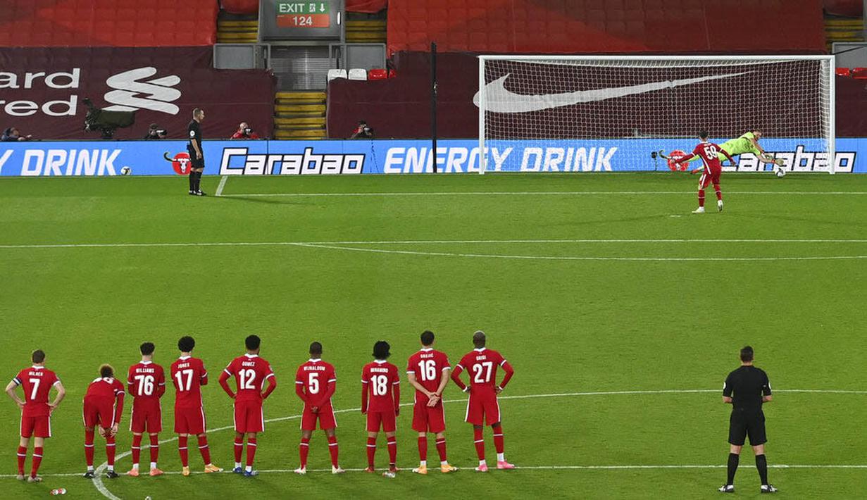 Dalam adu penalti, Bernd Leno, kembali tampil cemerlang dengan memghalau eksekusi Divock Origi dan Harry Wilson. (Laurence Griffiths/Pool via AP)